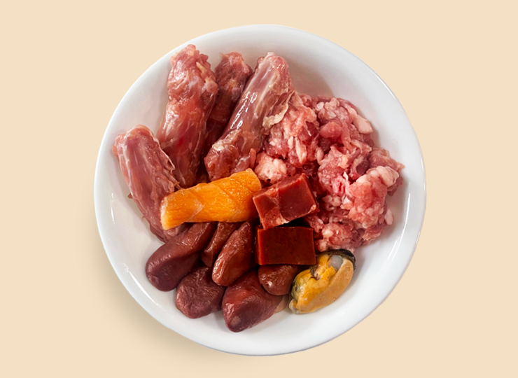 Aerial view of a raw cat food meal.